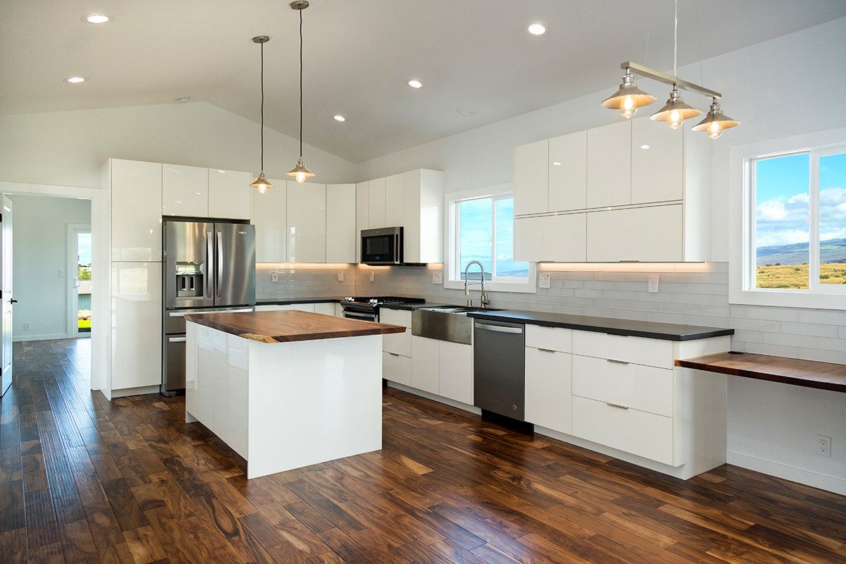 Kitchen with white gloss cabinets and farmhouse sink